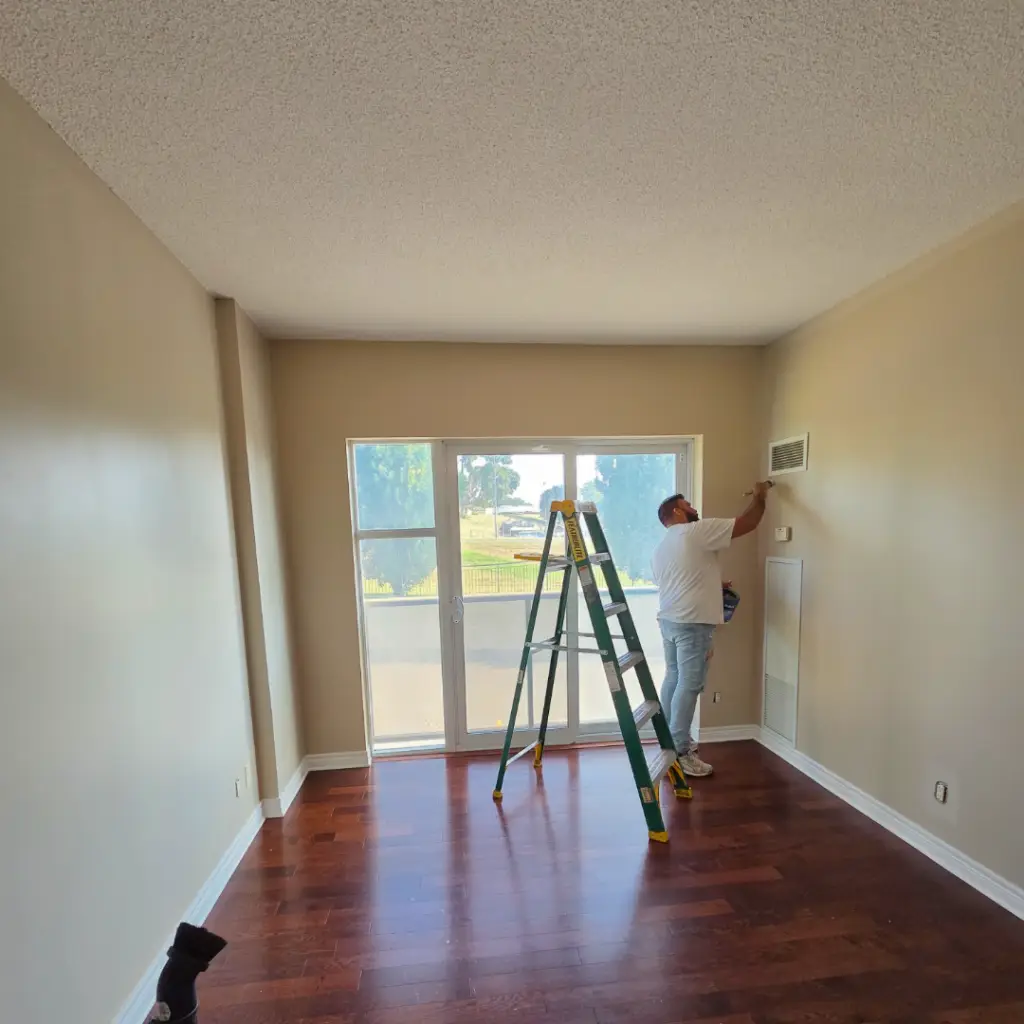 Suite interior with old flooring removed during a senior living unit turnover