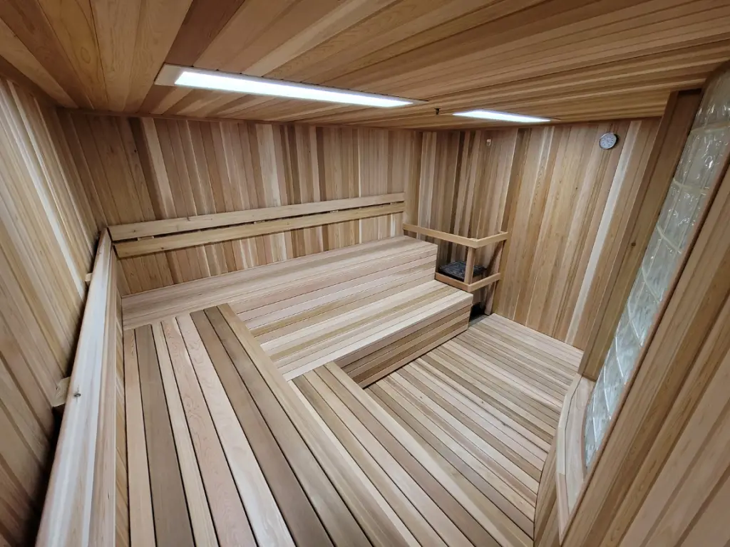 Completed cedar sauna interior with new benches and cladding at a Life Time club