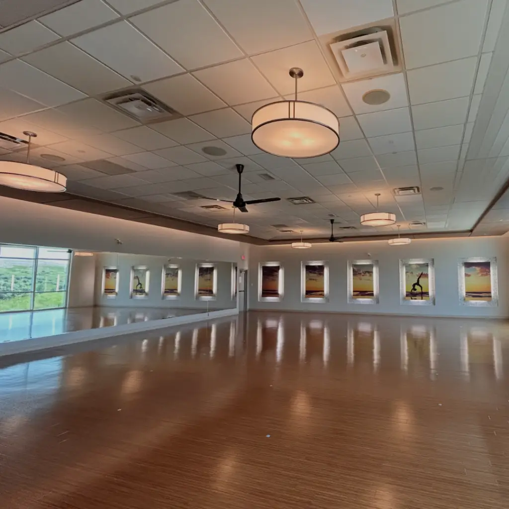 Completed hot yoga studio with ceiling diffusers and fans supplying the space