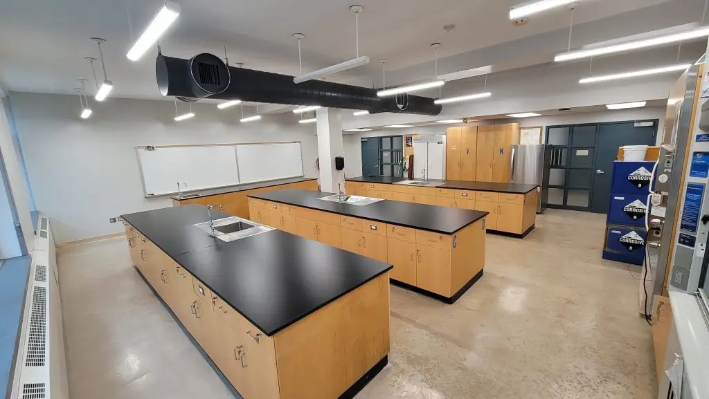 Renovated university teaching laboratory with epoxy resin benches, service islands and exhaust ductwork